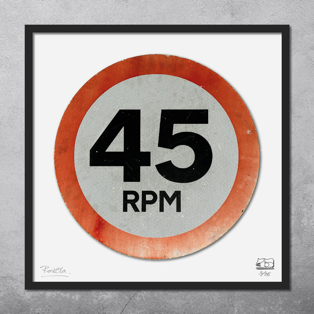 The RocknRoad Sign Print - 45 RPM by My Store is a limited edition framed music art piece (only 25 made), featuring a circular sign design with “45 RPM” in bold black text, red border, and gray background.