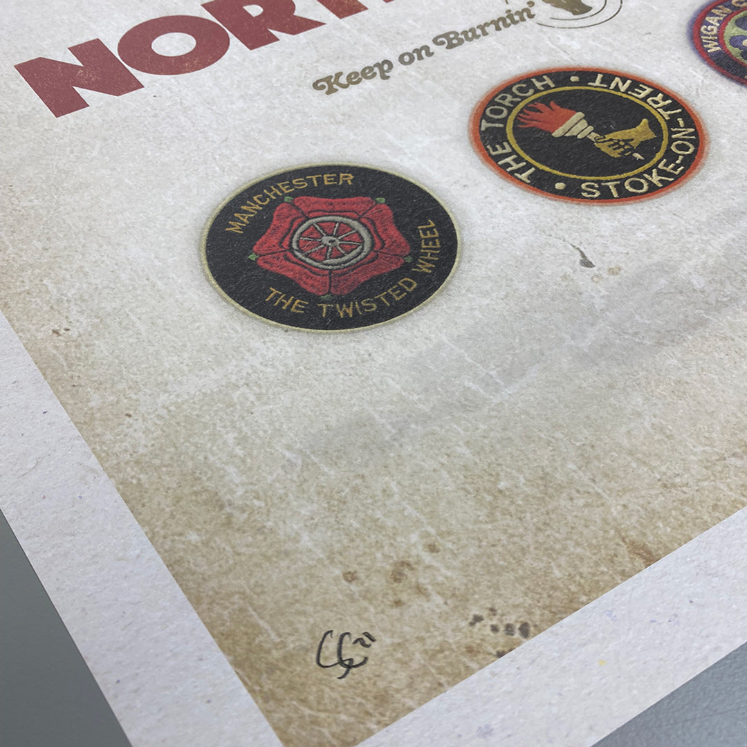 Close-up of the Northern Soul Poster Print—Limited Edition of Only 100 by My Store—showing vintage-style patches: a red steering wheel with Manchester The Twisted Wheel and a torch with The Torch, Stoke-on-Trent, plus Simon Colletts signature.