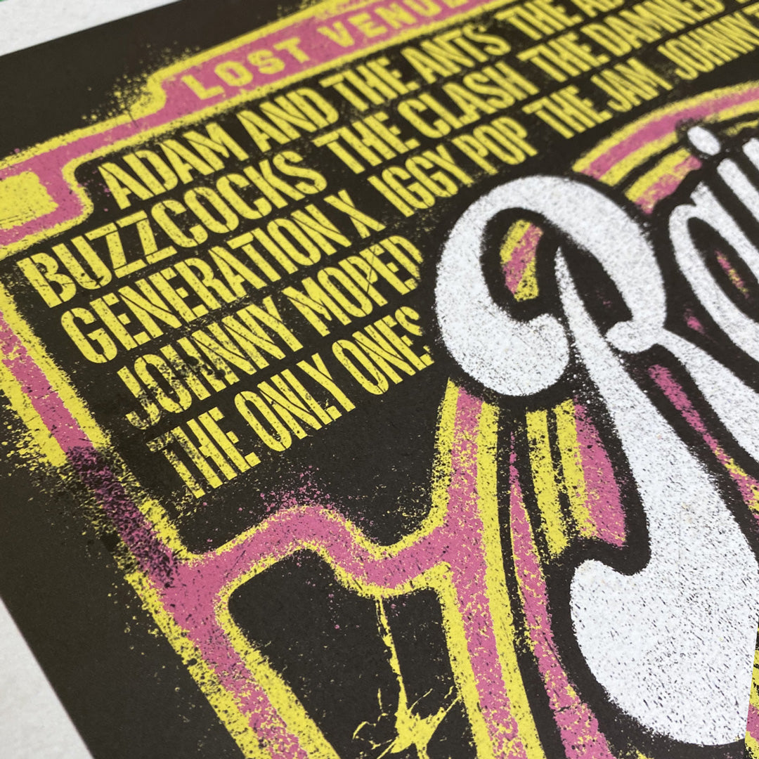 Close-up of the Rainbow Punk Poster Print by My Store—limited edition of only 100—showcasing band names like Adam and the Ants and The Clash in yellow on black, inspired by the Rainbow Punk Retrospective at The Rainbow Theatre.