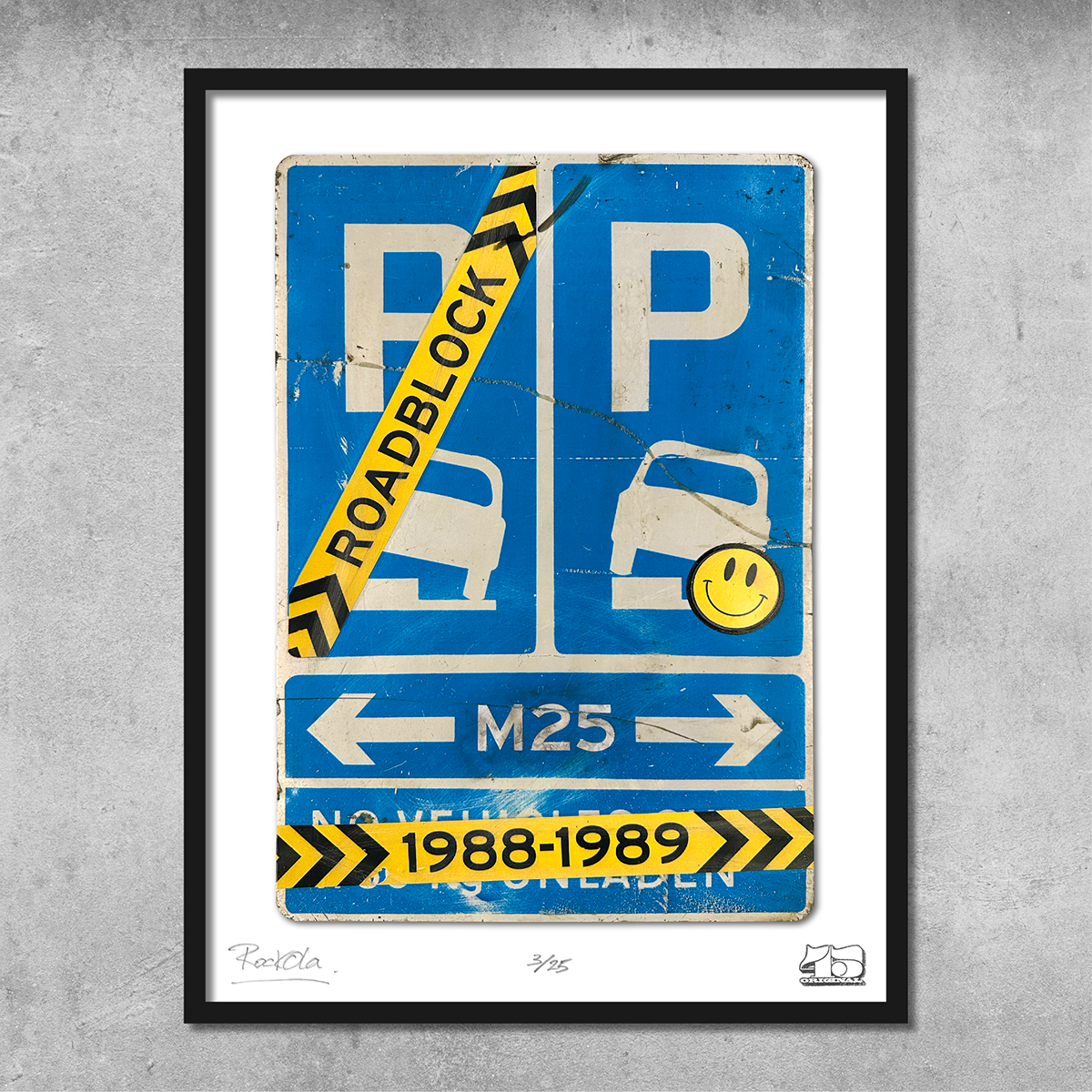 The RocknRoad Sign Print - Roadblock Rave by My Store is a limited edition (25) framed UK Metal M25 road sign artwork, featuring ROADBLOCK tape, a yellow smiley sticker, and ‘1988-1989’ in yellow—celebrating the Road to Rave era.