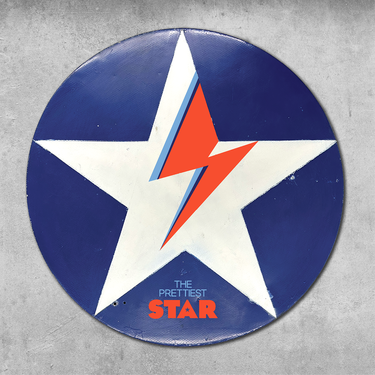 The 45 Original Rock’n’Road Sign – The Prettiest Star features a large white star with a red and blue lightning bolt on blue, plus THE PRETTIEST STAR text on an original UK metal road sign, set against a concrete backdrop.