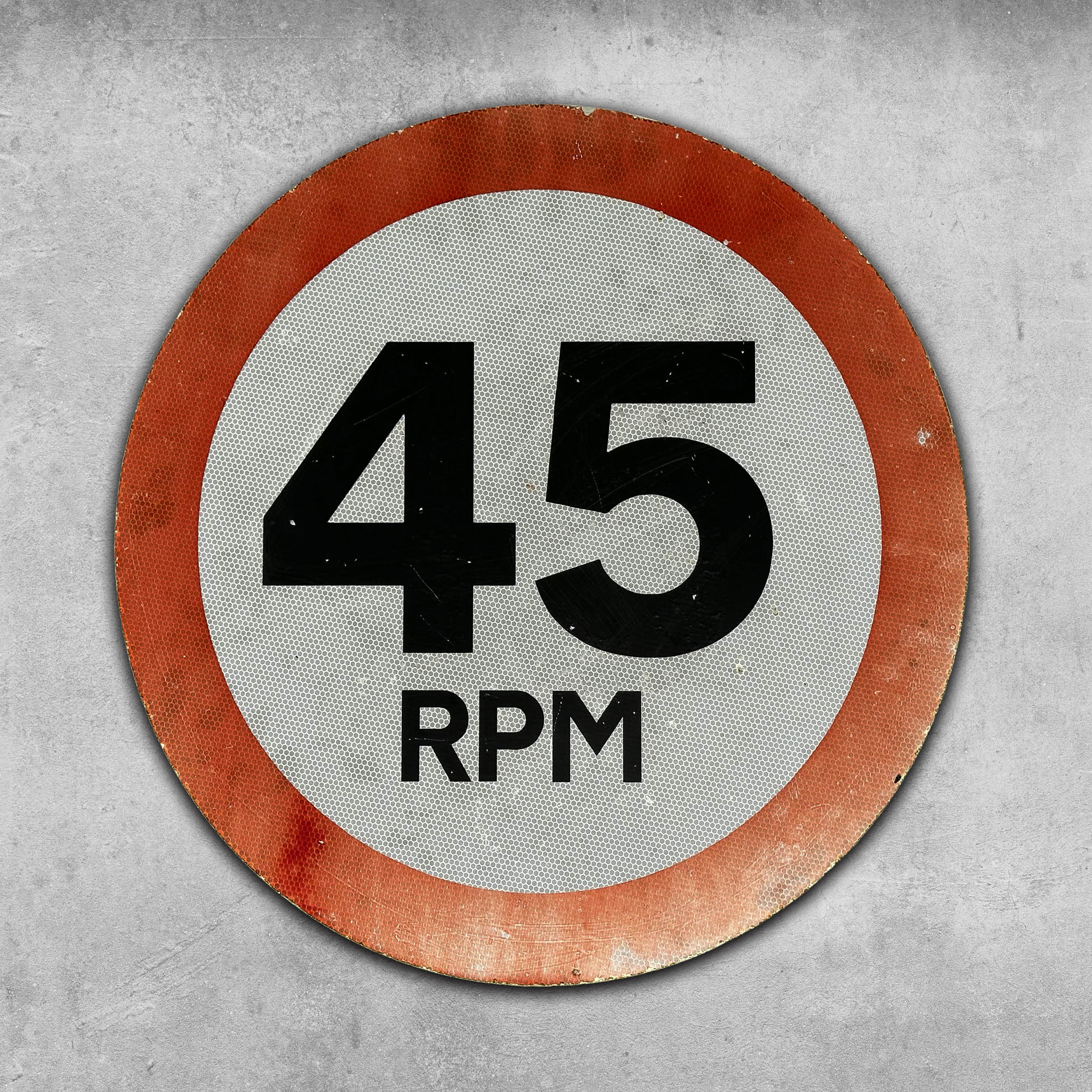 The Original RocknRoad Sign - 45 RPM by My Store features bold black lettering on a white background with a red border, making it the perfect unique man cave decor, as shown mounted on a textured gray wall.