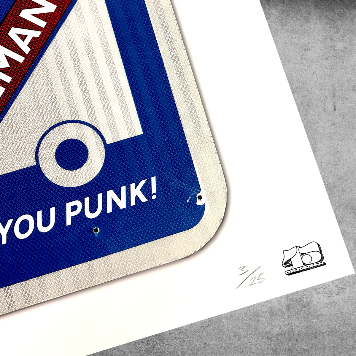 A close-up of the RocknRoad Sign Print - Garbageman by 45 Original, a limited edition giclée print (3/25), shows YOU PUNK! text with blue, white, and red colors and a rhinoceros logo on a gray surface.